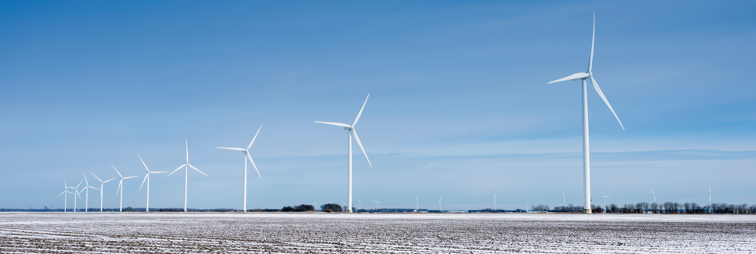 A field of wind energy generators in a cold climate with ice protection systems