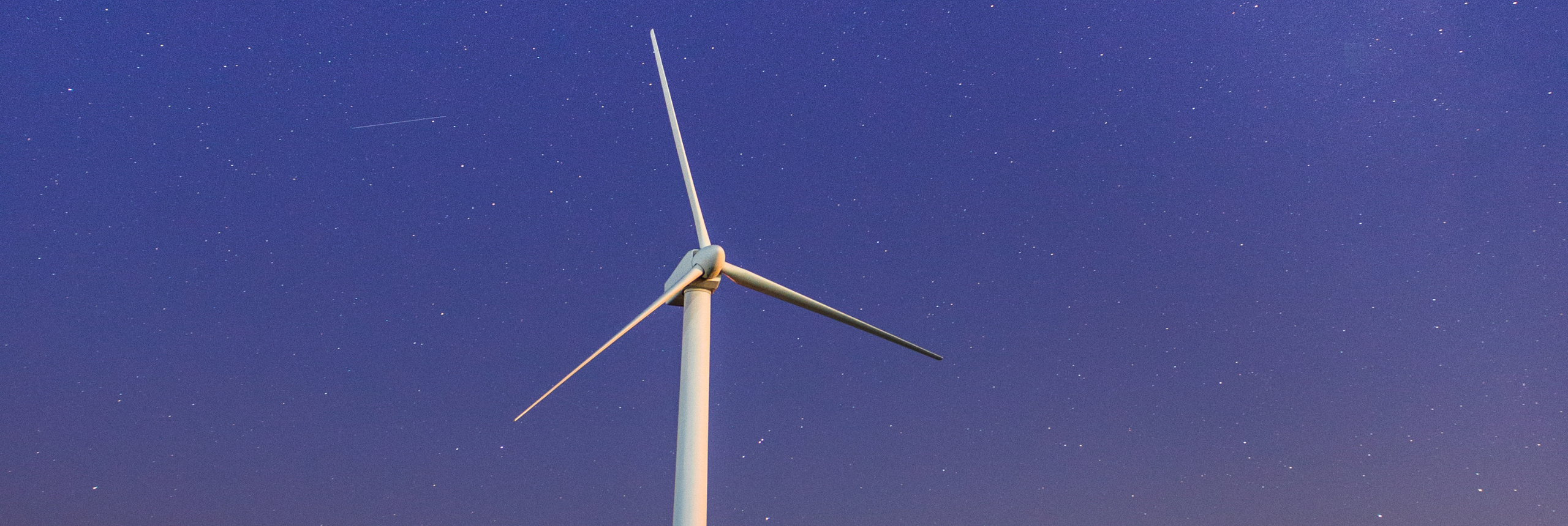 Wind turbine in the night sky